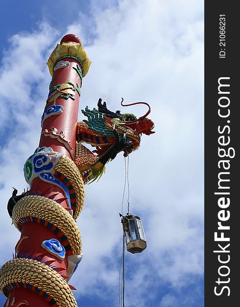 Dragon Statue on the red column in Chinese temple, Thailand