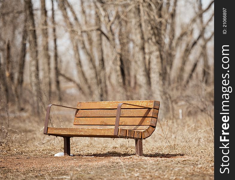 Park bench in bow valley park pathway Calgary Alberta. Park bench in bow valley park pathway Calgary Alberta