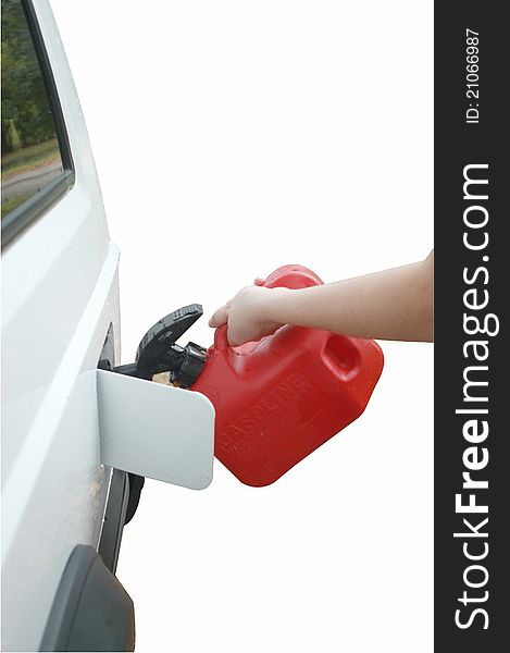 Hand holding gas can up to car isolated