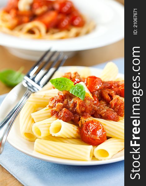 Pasta with tomato sauce,cherry tomatoes and basil. Pasta with tomato sauce,cherry tomatoes and basil