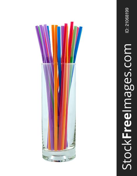 Glass with color tubes isolate on white background. Glass with color tubes isolate on white background.