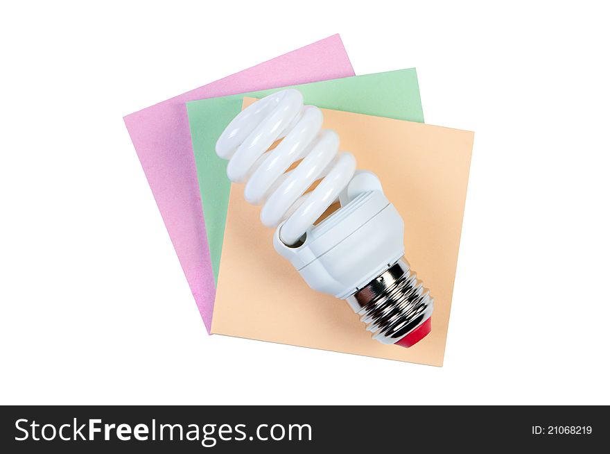 Energy saving lamp and color stickers isolated on white background. Energy saving lamp and color stickers isolated on white background.