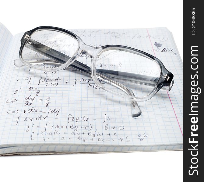 Copybook of physics with glasses isolated on white
