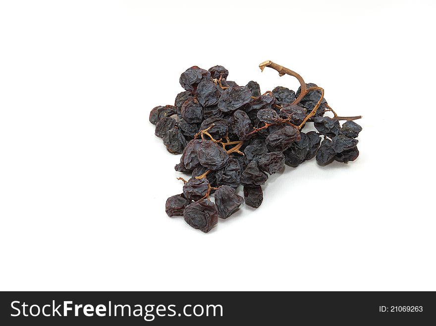 Bunch of raisins on a white background