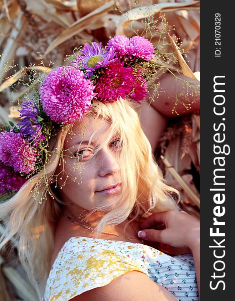 Young woman in corn haystack