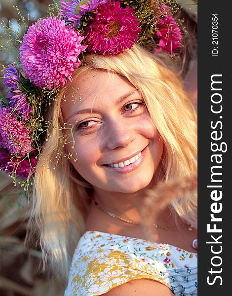 Young woman in corn haystack with wreath. Young woman in corn haystack with wreath