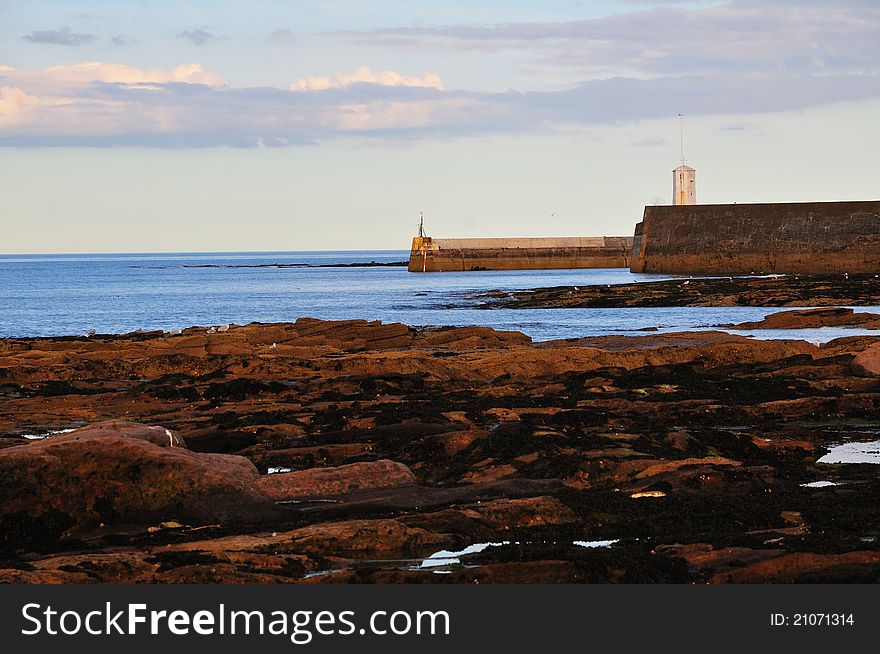 Harbour mouth of a small fishing village on the Northumbrian coast. Harbour mouth of a small fishing village on the Northumbrian coast.