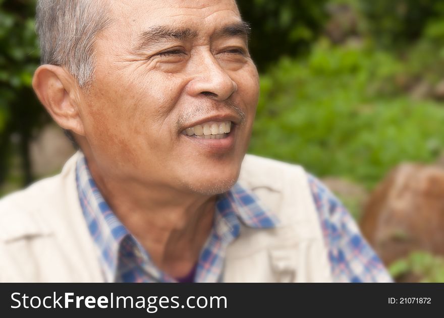 Closeup Profile on an old man Smiling. Closeup Profile on an old man Smiling