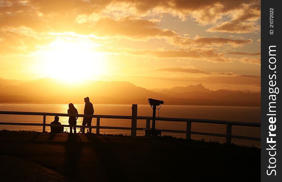 Beautiful sunset in Byron Bay, NSW with people chillin' in sunlight