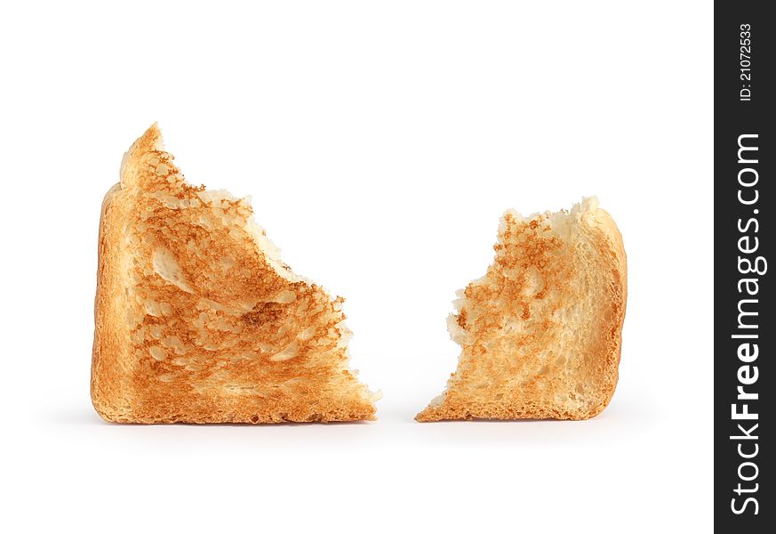 Two bits of toast isolated on white background. Clipping path is included. Two bits of toast isolated on white background. Clipping path is included