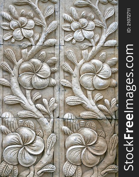 Flower shape stone carving on wall in bali style