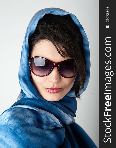 Portrait of young woman in big sunglasses. Portrait of young woman in big sunglasses.