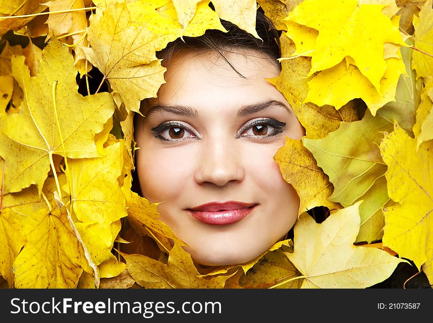 Women in the yellow autumn leaves.