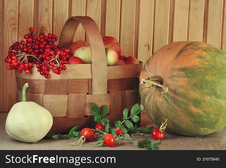 Vegetables, fruit and berries in a rural wattled basket