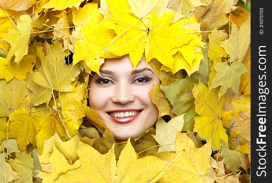 Portrait of the young woman in autumn leaves. Portrait of the young woman in autumn leaves.