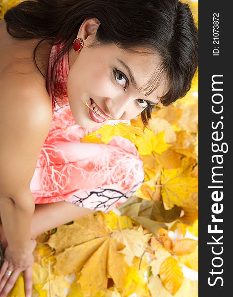 Autumn woman in the yellow leaves. Autumn woman in the yellow leaves.