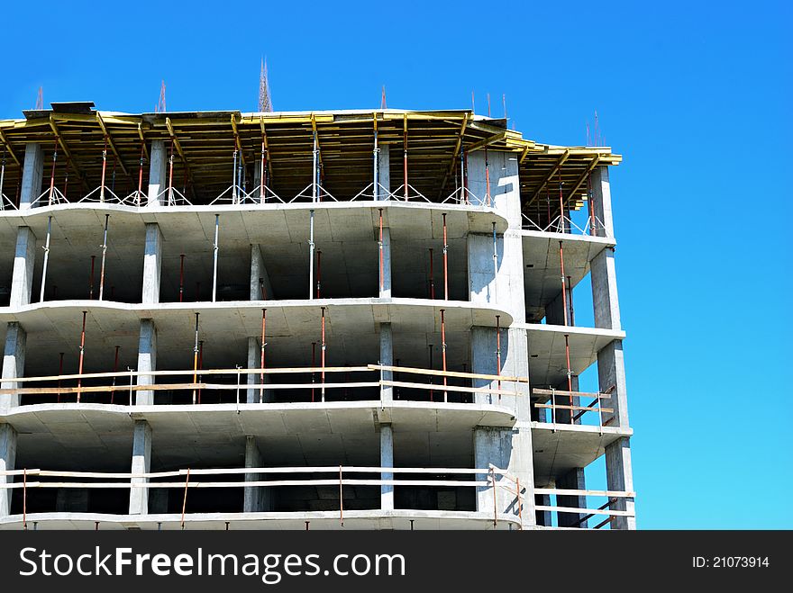 Construction site and angle of building on blue sky background. Construction site and angle of building on blue sky background