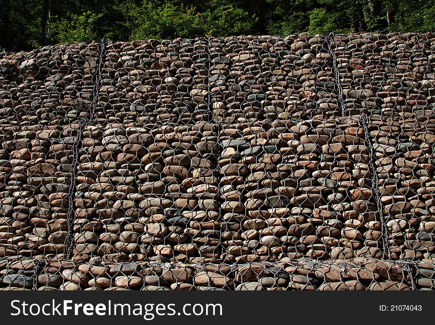 A wire mesh gabion wall