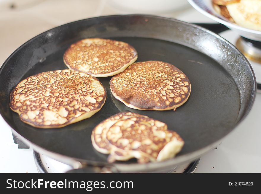 Cooking pancakes in a frying pan