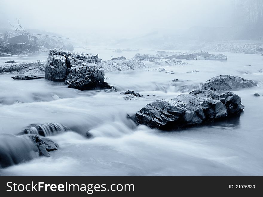 Cool river with fog in winter