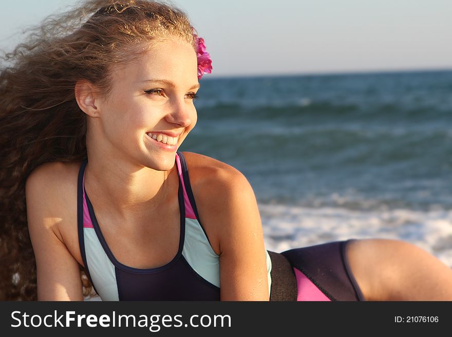 Young happy woman resting on sea background. Young happy woman resting on sea background