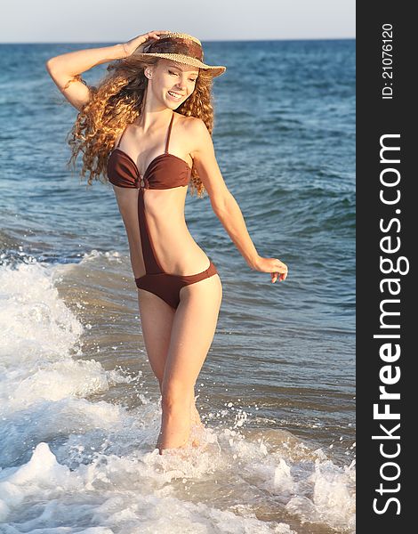 Young smiling woman on sea background