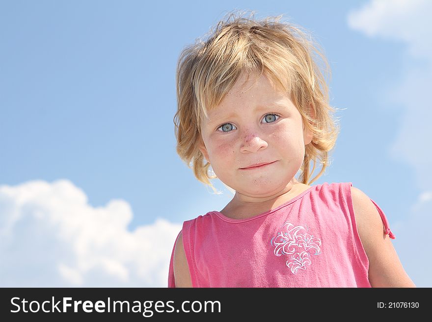 Cute young girl on sky background