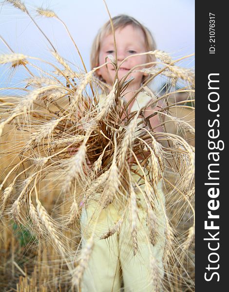 Child with wheat ears