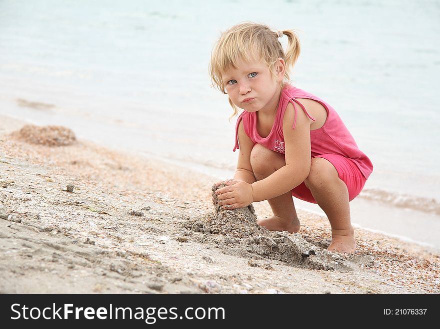 Cute girl playing on beach