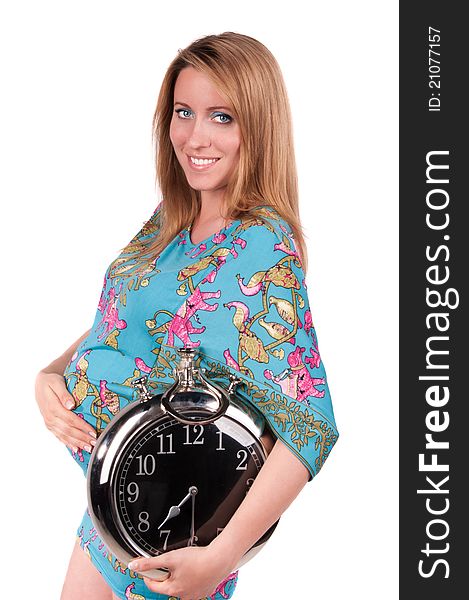 Portrait of happy pregnant woman with clock