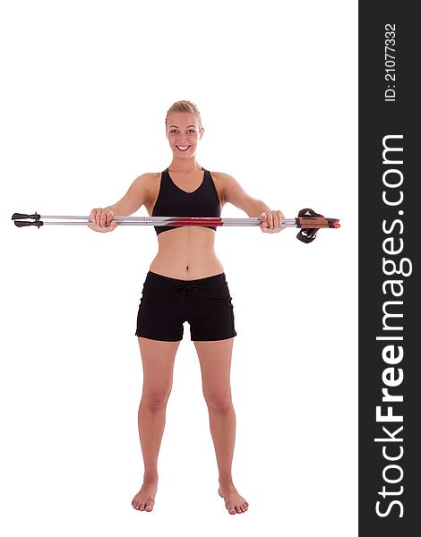 A young beautiful woman with Nordic Walking sticks