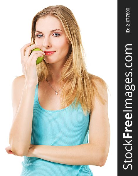 Portrait of lovely girl with green apple against white background