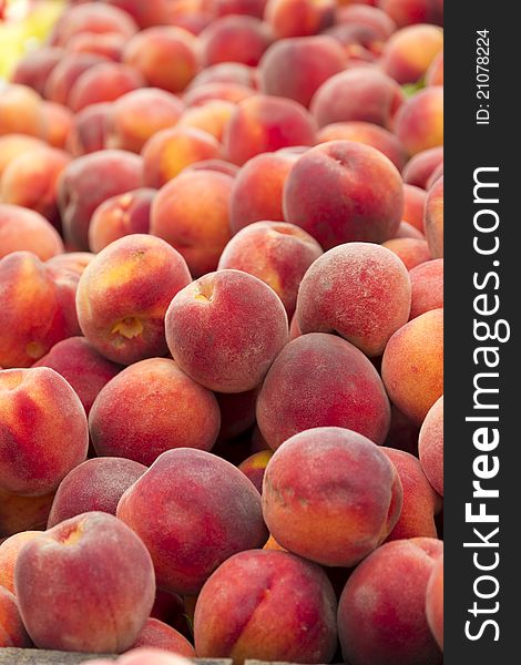 Pile of peaches for sale.