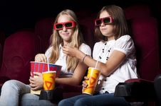 Two Beautiful Girls Watching A Movie At The Cinema Stock Photography Two Beautiful Girls Watching A Movie At The Cinema Stock Photography