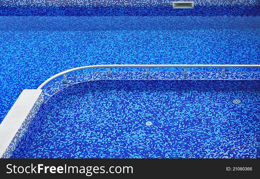 Swiming pool with blue mosaic tiles