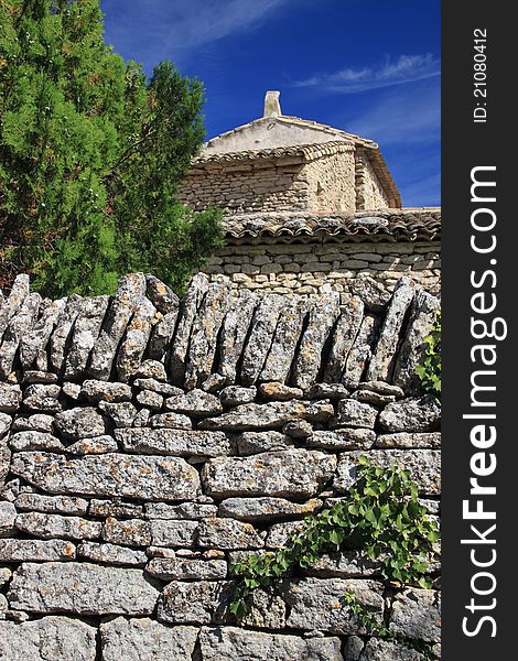 Old stone wall of a house in Southern France. Old stone wall of a house in Southern France