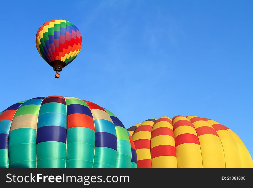 Hot air balloons over blue sky