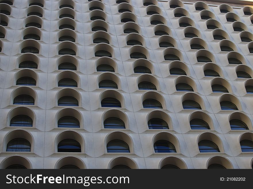 Textured and arched windows of a downtown Phoenix Arizona hotel. Textured and arched windows of a downtown Phoenix Arizona hotel.