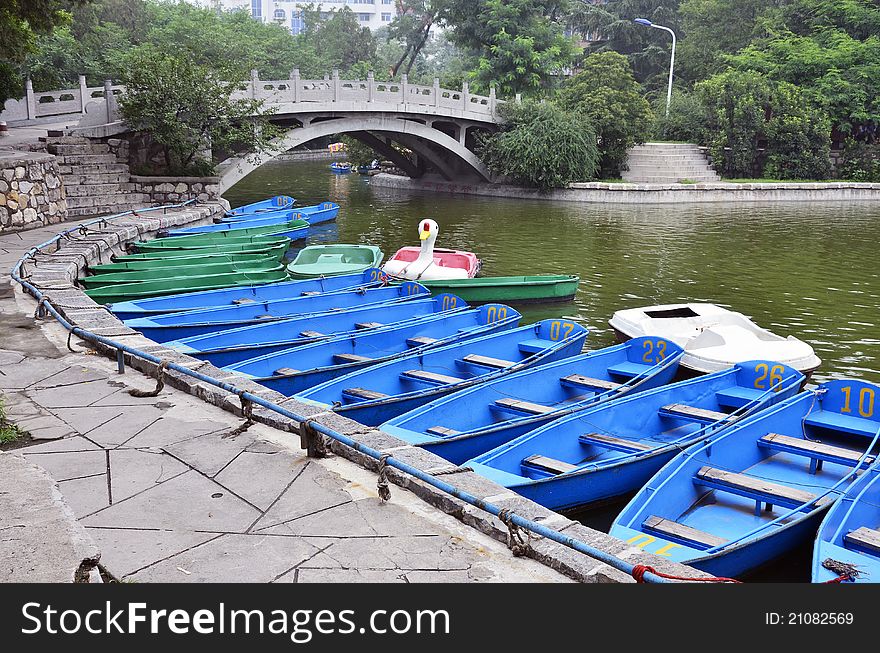 Blue boats on a lake in the park