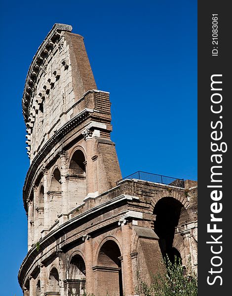 Colosseum in Rome with blue sky, landmark of the city. Colosseum in Rome with blue sky, landmark of the city