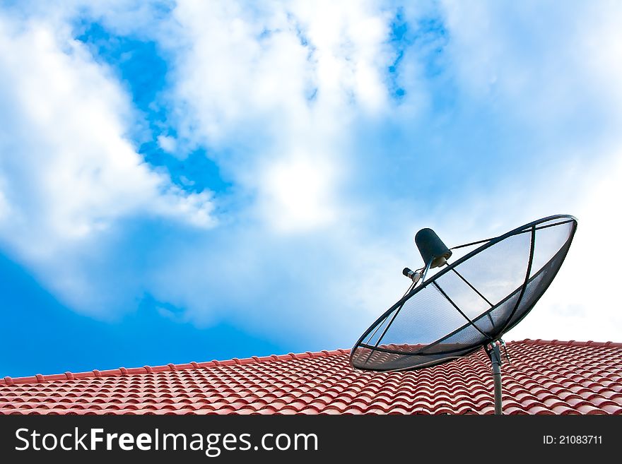 Satellite dish on the roof against the sky