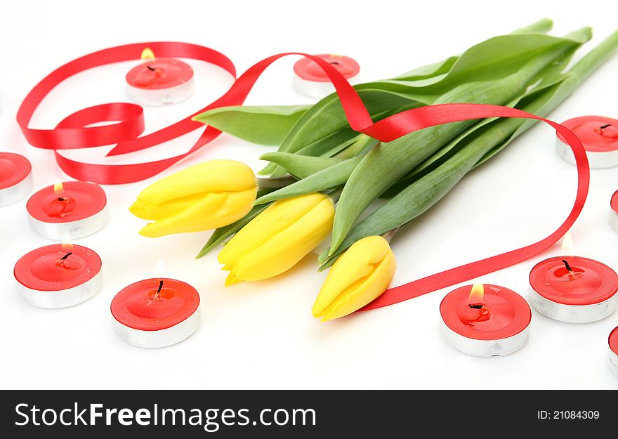 Yellow tulips and tape on a white background