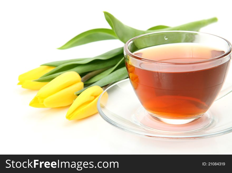 Tea And Yellow Tulips
