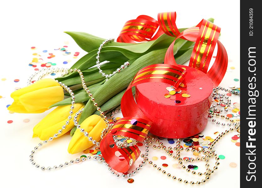 Gift and flowers on a white background