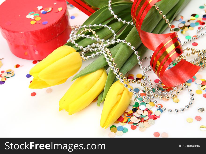 Gift and flowers on a white background