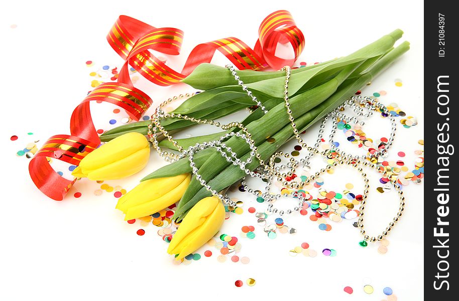 Tulips and streamer on a white background