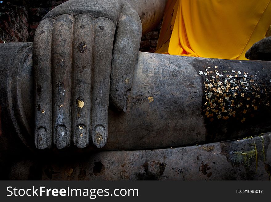 Hand of buddha sculpture with gold