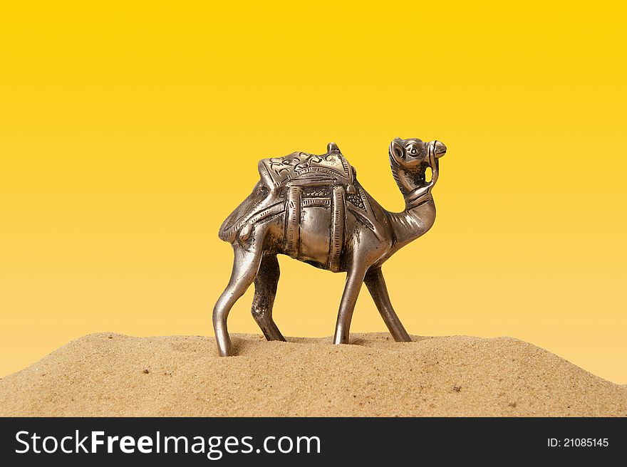 Figurine of a camel made of metal, isolation