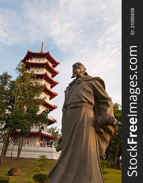 Historical Chinese statue and Oriental pagoda in Chinese Garden at sunrise. Historical Chinese statue and Oriental pagoda in Chinese Garden at sunrise.