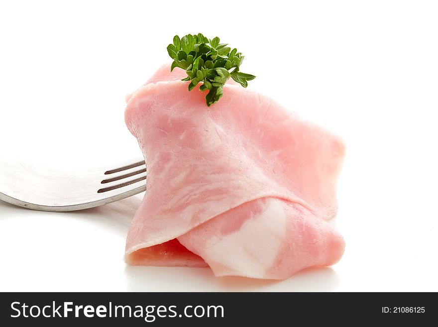 Photo of delicious ham sliced wrapped on fork over white background. Photo of delicious ham sliced wrapped on fork over white background